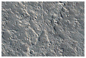 Cones and Channels East of Olympus Mons