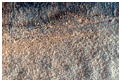 Channel Deposits on Hellas Planitia Rim to Floor Transition
