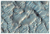 Mesa-Forming Layered Material and Adjacent Terrain
