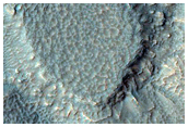 Monitor Slopes of Well-Preserved Crater in Aonia Terra
