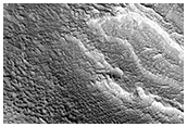 Layered Mantling Deposits in the Northern Mid-Latitudes