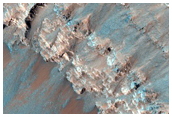 Steep Slope of Impact Crater on Floor of Huygens Crater
