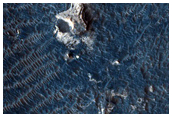 Blocky Deposit with Light-Toned Materials along Melas Chasma Floor
