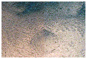 Crater with Central Uplift in Australe Montes
