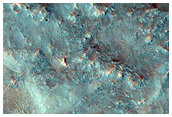 Various Landforms Including Ridges and Circular Mesas South of Capri Chasma
