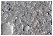 Curved and Branched Ridge and Trough Landforms in East Gusev Crater
