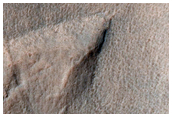 Small Crater in Aonia Terra
