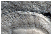Raised and Banded Arcuate Feature in Tantalus Fossae Crater
