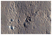 Layers Exposed on Rim of Crater in Lucus Planum
