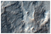 Pit in Mid-Latitude Mantle
