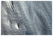 Multiple Curved Ridges at End of Valley in Protonilus Mensae
