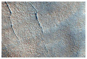 Pits in Valley on Rim of Moreux Crater
