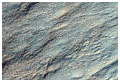 Monitor Gullied Slopes of Impact Crater
