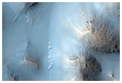 Pitted Terrain and Associated Channels in Sirenum Fossae Region
