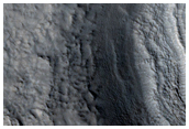 Layered Feature in Crater in Nilosyrtis Mensae
