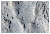Crater on Edge of Gigas Sulci
