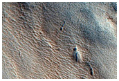 Pits Near Ridge and Trough Terrain in Protonilus Mensae
