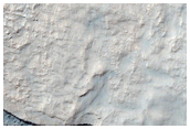 Possible Composition Diversity in Modified Crater Ejecta Deposit

