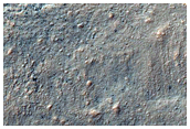 Flow Moving Out of Crater Northwest of Hellas Planitia
