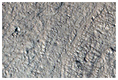Crater with Concentric Crater Fill in Acheron Fossae Region
