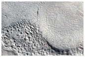 Pits and Cracks in Crater in Protonilus Mensae
