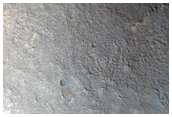 Mesa with Lobate Debris Flow South of Lyot Crater
