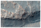 Inverted and Altered Light-Toned Terrain in Sirenum Fossae
