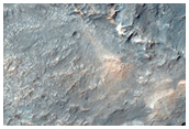 Dark-Toned Disks in Light-Toned Layer along Samara Valles

