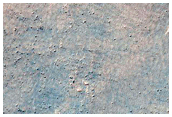 Curvilinear Landforms in Aonia Terra
