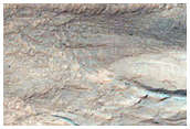 Eastern Portion of Gullied Impact Crater with Diverse Lithologies
