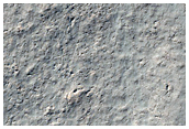 Flow Ridges in Crater in Promethei Terra
