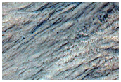 Gullies in Talus on Slope Cutting Layered Rock in North Hellas Planitia
