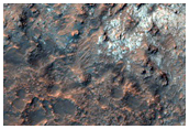 Intracrater Buttes and Lobate Feature
