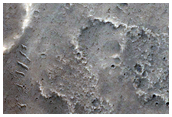 Pasted-on Material on Crater Ejecta
