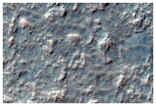Central Pit of Impact Crater and Gullies on Equator-Facing Slope
