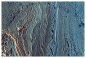 Layered Light-Toned Deposits on Floor of Orson Welles Crater
