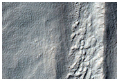 Flows and Layers in Promethei Terra
