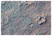 Lobate Features and Multi-Toned Pital Crater Ejecta
