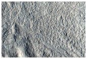 Dipping Layers in Degraded Crater in North Arabia Terra
