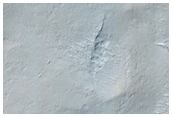 Contact between Apollinaris Patera and Medusae Fossae Formation  
