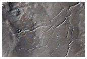Cracked Channel-Filling Deposit or Slumped Ejecta
