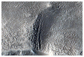 Two Exit Breaches in Young Crater

