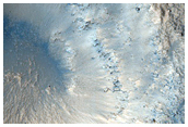 Crater Exposing Bedrock on Granicus Valles Ridge
