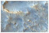 Ejecta and Secondaries of Well-Preserved Crater in Nilokeras Mensae
