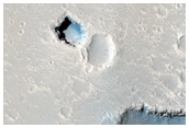 Pit Near Hephaestus Fossae
