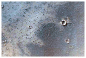 5-Kilometer Diameter Crater with Bright Material in Rim and Ejecta
