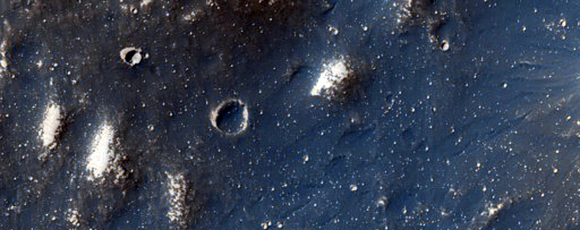 Pitted Material Near Rim of Sharonov Crater in Kasei Valles
