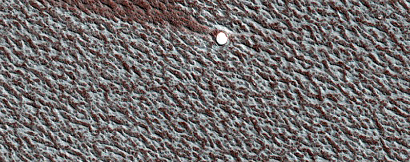 Small Ice-Filled Crater on North Polar Layered Deposits
