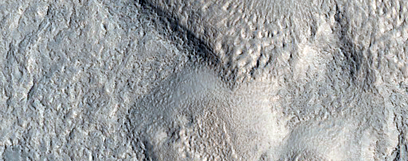 Dipping Layers in Depressions in Deuteronilus Mensae
