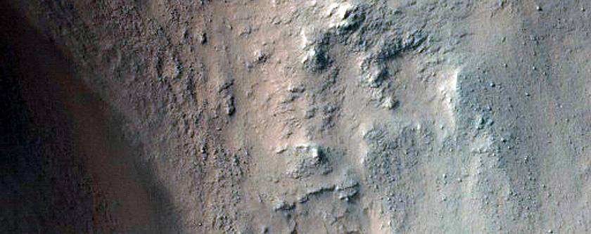 Exposure of Light-Toned Layering along Capri Chasma Wallrock
